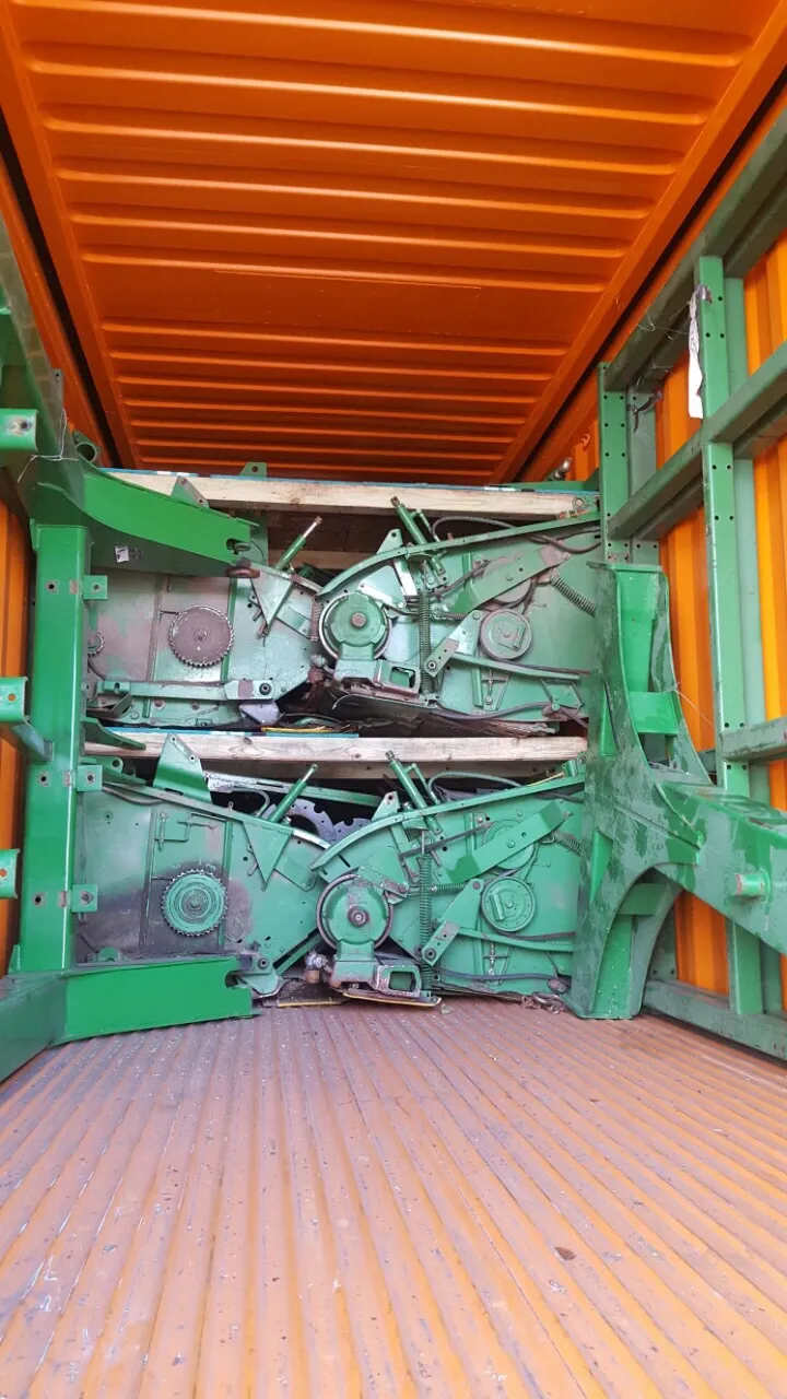 The green headers stacked on top of each other inside a container with a wooden board between them